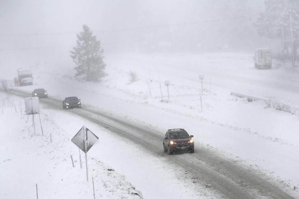 West bound traffic moves slowly on the I-80 at the Donner Pass Exit on Friday, March 1, 2024, in Truckee, Calif. The most powerful Pacific storm of the season is forecast to bring up to 10 feet of snow into the Sierra Nevada by the weekend. (AP Photo/Andy Barron)