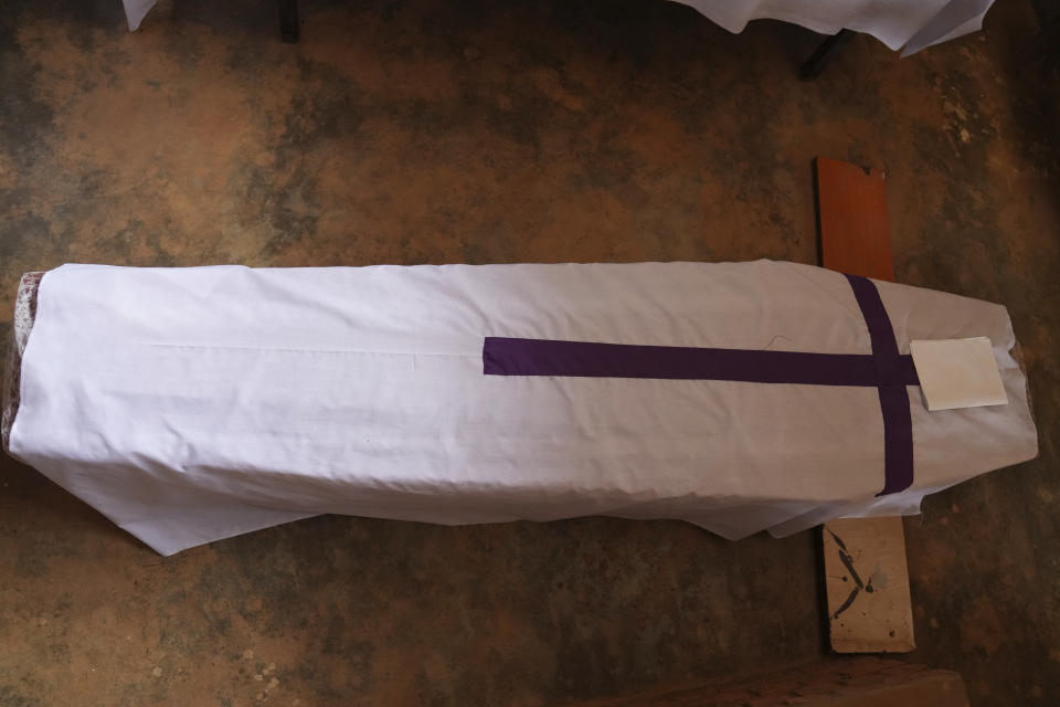 A coffin containing newly discovered remains of a victim of the 1994 genocide is arranged before a funeral ceremony of victims who were killed during the 1994 genocide in a Catholic church, in Nyamata, Rwanda, Friday, April 5, 2024. An estimated 800,000 Tutsis were killed by extremist Hutus in massacres that lasted over 100 days in 1994. Some moderate Hutu who tried to protect members of the Tutsi minority were also targeted. (AP Photo/Brian Inganga)