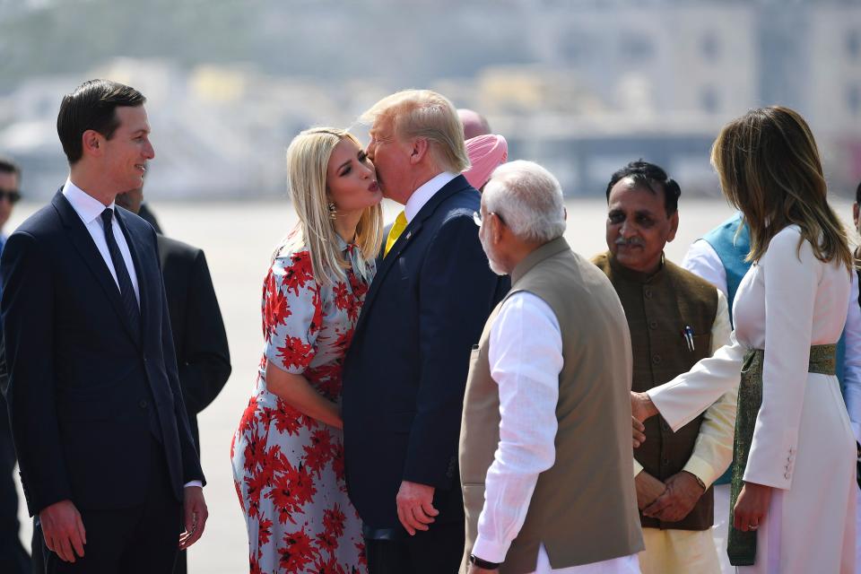 US President Donald Trump (C) kisses White House senior advisor Ivanka Trump as India's Prime Minister Narendra Modi (R) looks on upon their arrival at Sardar Vallabhbhai Patel International Airport in Ahmedabad on February 24, 2020. (Photo by Mandel NGAN / AFP) (Photo by MANDEL NGAN/AFP via Getty Images)