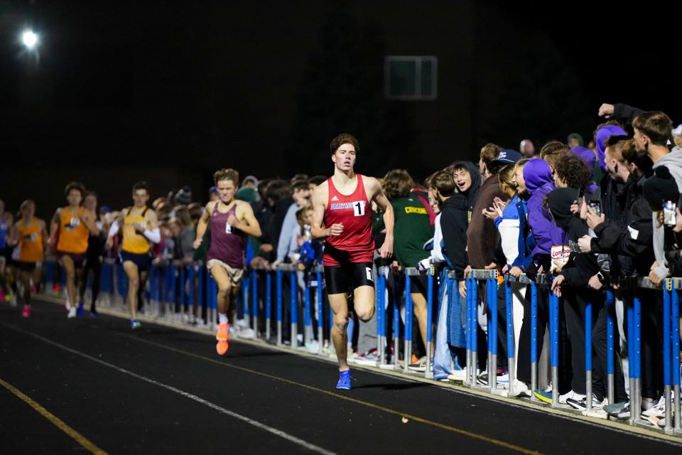 Martin Barco, of Martinsville High School, leads the runners from the track and field boys heat 4 competition in the Miracle Mile race during the Flashes Showcase on Friday, April 12, 2024, at Franklin Central High School in Indianapolis. Martin Barco, of Martinsville High School, finished in first place with a time of 4:11.53. Cameron Todd, of Brebeuf Jesuit Preparatory School, finished with a time of 4:13.01. Roman Sierpina, of Louisville Collegiate School, finished in third place with a time of 4:14.44.