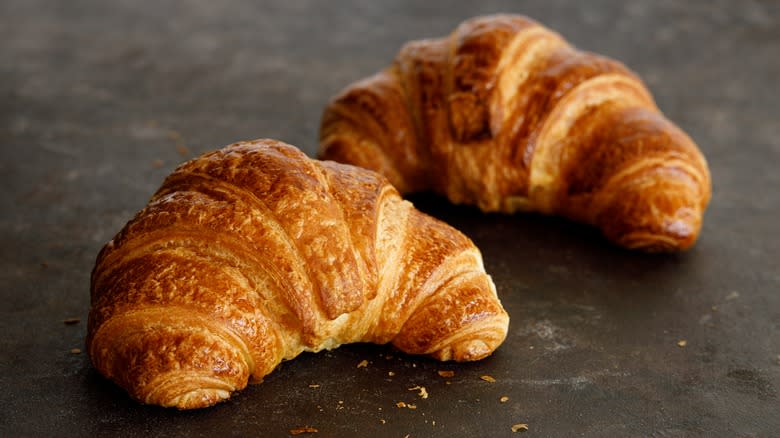 Croissant dough on gray slab