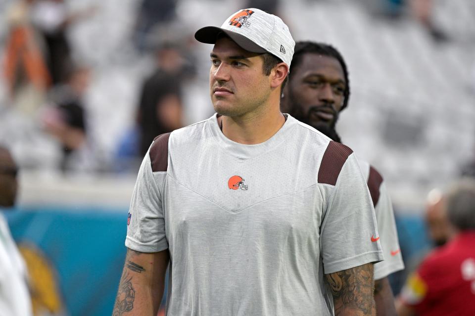 Cleveland Browns offensive tackle Jack Conklin watches warmups before an NFL preseason football game against the Jacksonville Jaguars, Aug. 14, 2021, in Jacksonville, Fla. Conklin and Browns dynamic running back Kareem Hunt were designated for return from injured reserve and could play in this week's AFC North showdown against Baltimore. Hunt and Conklin will practice Wednesday, Nov. 24, 2021. (AP Photo/Phelan M. Ebenhack)