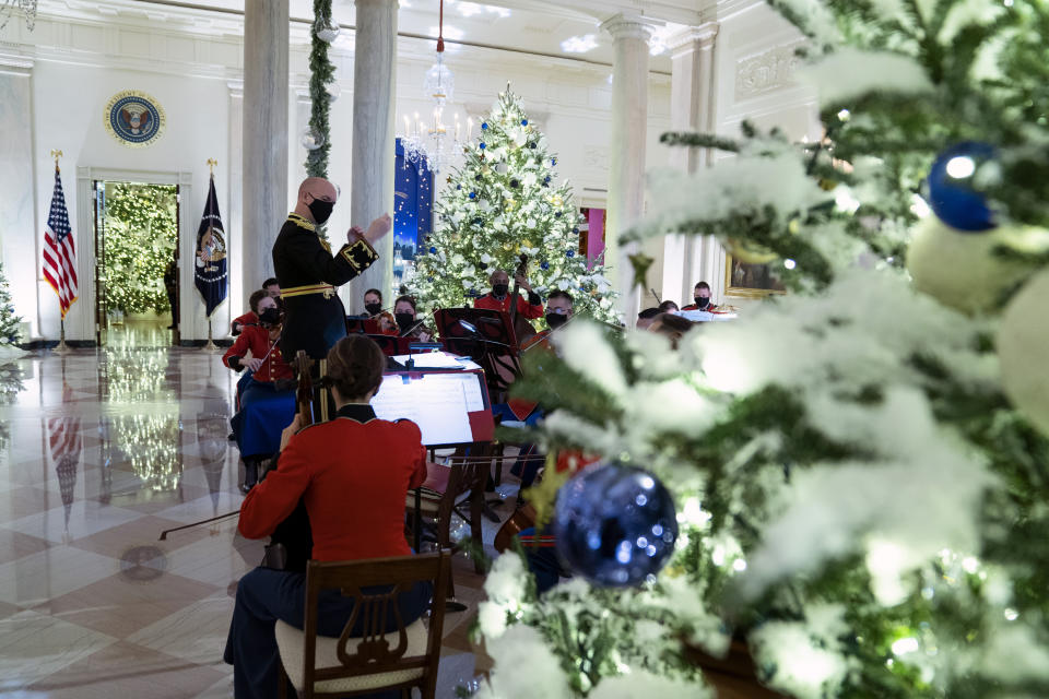 A Marine band plays Christmas music in the Grand Foyer of the White House during a press preview of the White House holiday decorations, Monday, Nov. 29, 2021, in Washington. (AP Photo/Evan Vucci)