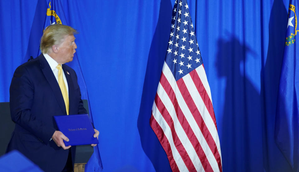 A graduate walks up to receive his diploma from U.S. President Donald Trump at the Hope for Prisoners Graduation Ceremony attended in Las Vegas, Nevada, February 20, 2020. REUTERS/ Kevin Lamarque