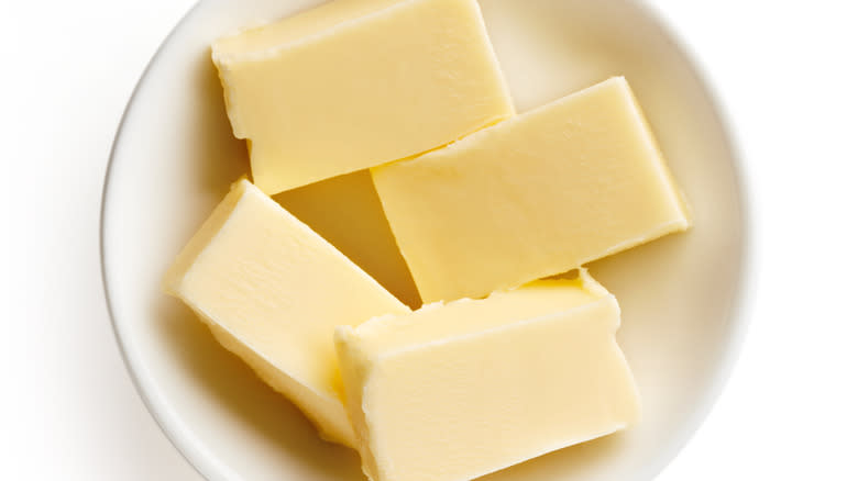 butter cubes in white bowl