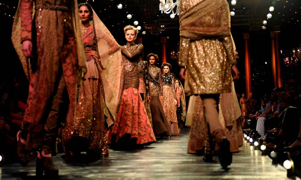 Models showcase a creation by Indian designer Sabyasachi during the Grand Finale of the Lakme Fashion Week (LFW) Winter/Festival 2013 in Mumbai on August 27, 2013.