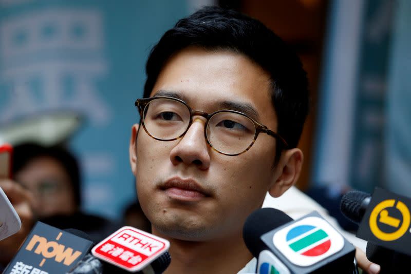 Pro-democracy activist Nathan Law is interviewed by journalists outside the Final Court of Appeal after being granted bail in Hong Kong