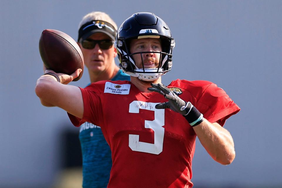 Jacksonville Jaguars quarterback C.J. Beathard (3) throws as quarterbacks coach Mike McCoy looks on Tuesday, Aug. 1, 2023 at Miller Electric Center at EverBank Stadium in Jacksonville, Fla. Today marked the first padded practice. 