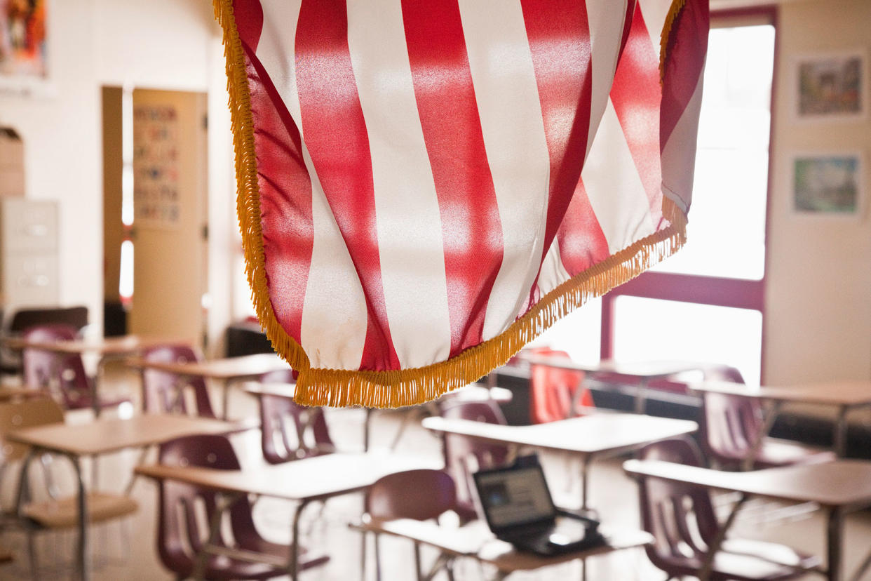 American Flag Hanging in Classroom Getty Images/Glasshouse Images