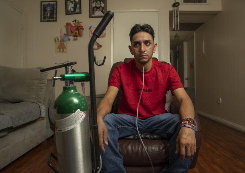PACOIMA, CA-SEPTEMBER 8, 2023: Leobardo Segura Meza, 27, who suffers from silicosis, an incurable lung disease that has been afflicting workers who cut and polish engineered stone high in silica, is photographed at his home in Pacoima. (Mel Melcon / Los Angeles Times)