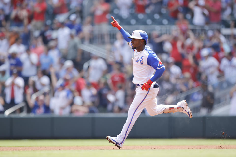 Atlanta Braves second baseman Ozzie Albies (1) gestures after hitting a single home run in the first inning against the Miami Marlins during a baseball game Saturday, July 1, 2023, in Atlanta. (AP Photo/Alex Slitz)