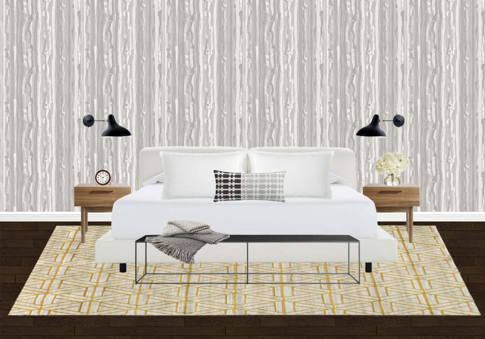 <p>For a level of dimension, Ashley went with a textured wallpaper inside the master bedroom. "The pop of color in the rug adds flavor to the design, and the low-profile bed paired with natural wood night stands lead to the eclectic flair of the room," says Ashley.</p>