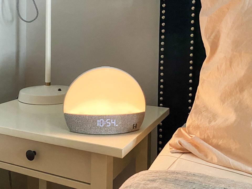 hatch restore alarm clock on bedside table