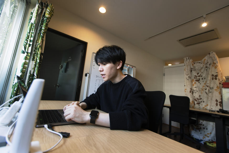 Koki Ozora, a college student who started a nonprofit called "Anata no Ibasho," or "A Place for You," talks with a woman who'd like to help Ozora's organization, as he speaks in his office in Tokyo on Friday, Oct. 2, 2020. Suicides are on the rise among Japanese teens and that worries 21-year-old Ozora, who grew up depressed and lonely. His online Japanese-language chat service, run entirely by volunteers, offers a 24-hour text-messaging counseling for those seeking a sympathetic ear, promising to answer every request, within five seconds for urgent ones. (AP Photo/Hiro Komae)