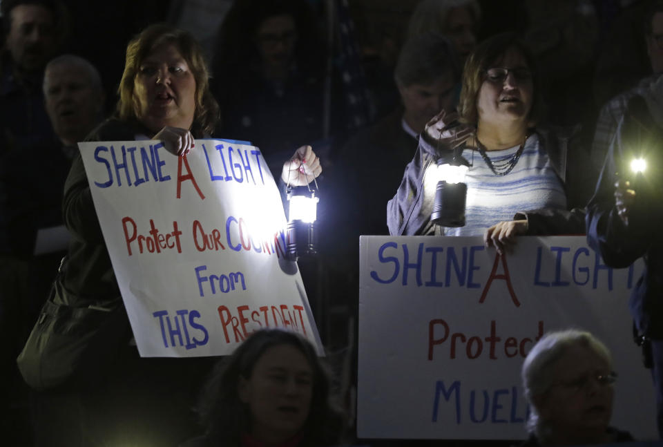 Protesters listen to a speaker during a rally outside the Guilford County Courthouse against President Trump's Attorney General move that could jeopardize the Special counsel's work in Greensboro, N.C., Thursday, Nov. 8, 2018. (AP Photo/Chuck Burton)