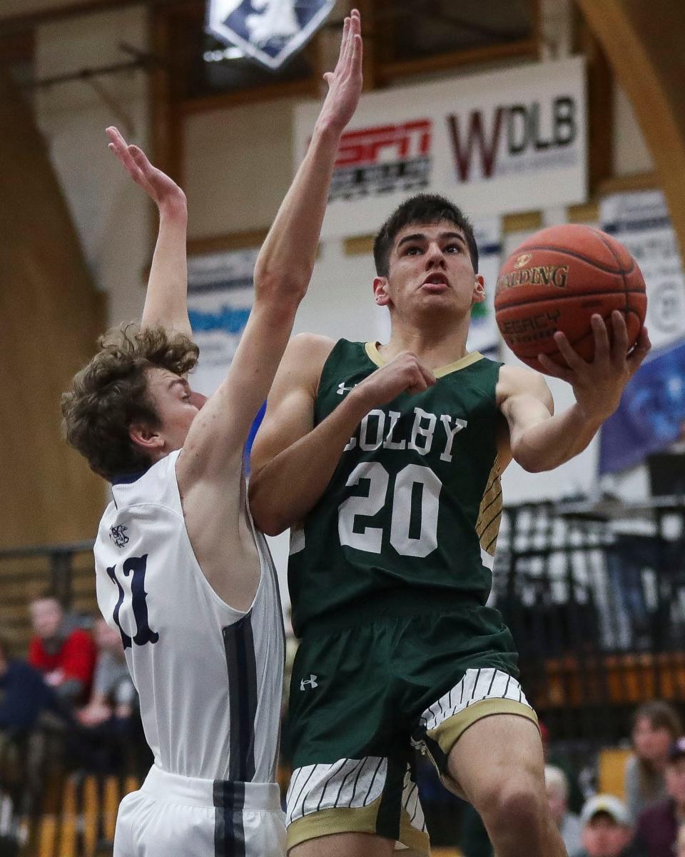 Colby's Mateo Lopez goes up for a layup against Columbus Catholic during Tuesday's game in Marshfield.