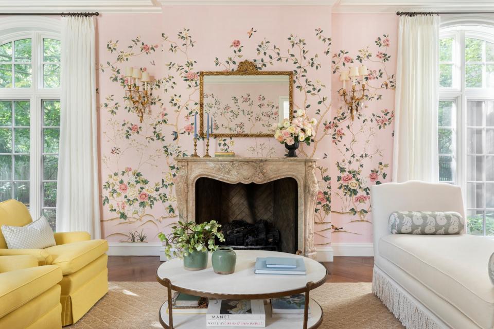 For a home in Lake Forest, Illinois, Alexandra Kaehler used her clients’ collection of French antiques as a jumping-off point. The designer reupholstered them in olive green and butter yellow to balance the femininity of the pink mural chinoiserie paper that the firm chose.