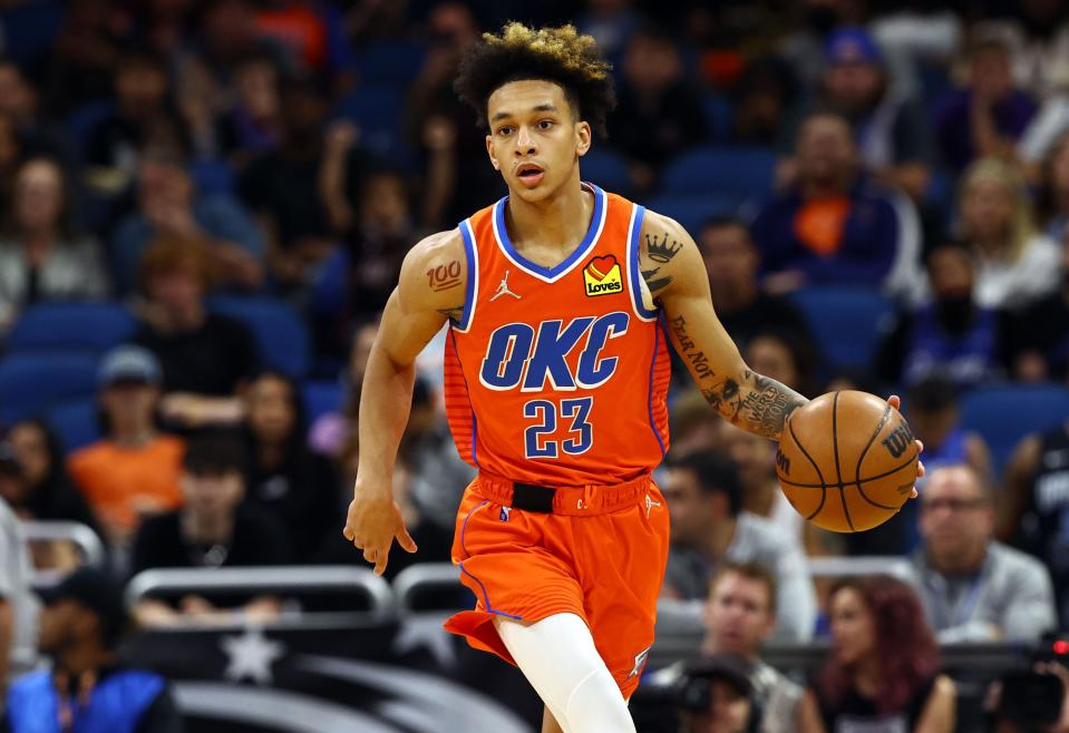 Oklahoma City Thunder guard Tre Mann (23) drives to the basket against the Orlando Magic during Sunday's game at Amway Center.