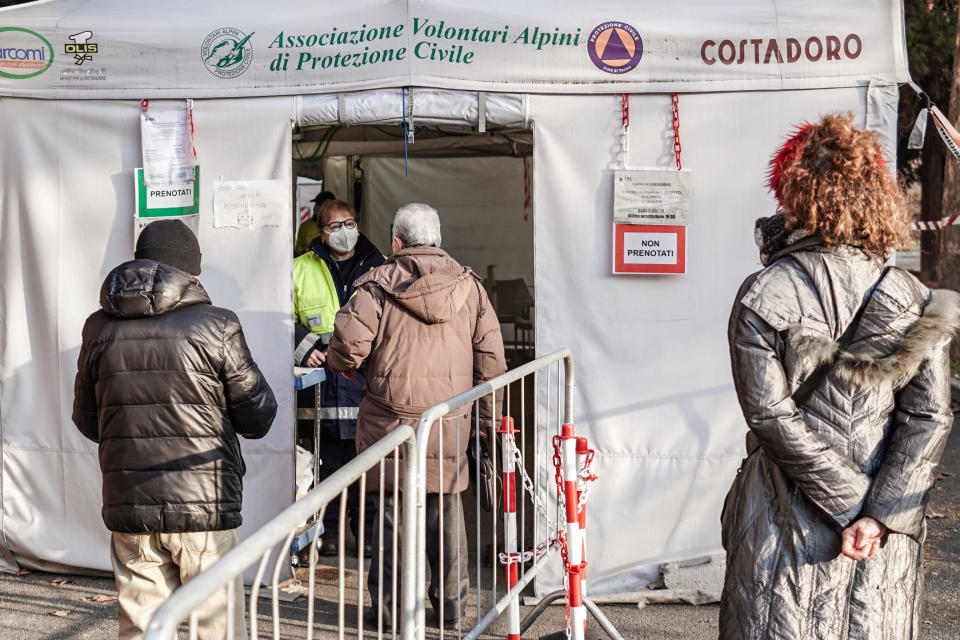 People outside a COVID vaccination center in Turin, Italy.