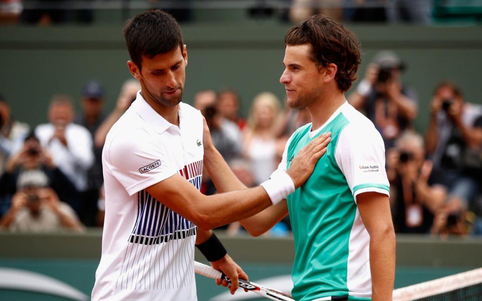 Novak Djokovic was upset by the young Austrian Dominic Thiem (R) on Wednesday - Getty Images Europe