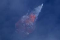 A SpaceX Falcon 9 rocket engine self-destructs after jettisoning the Crew Dragon astronaut capsule during an in-flight abort test after lift of from the Kennedy Space Center in Cape Canaveral