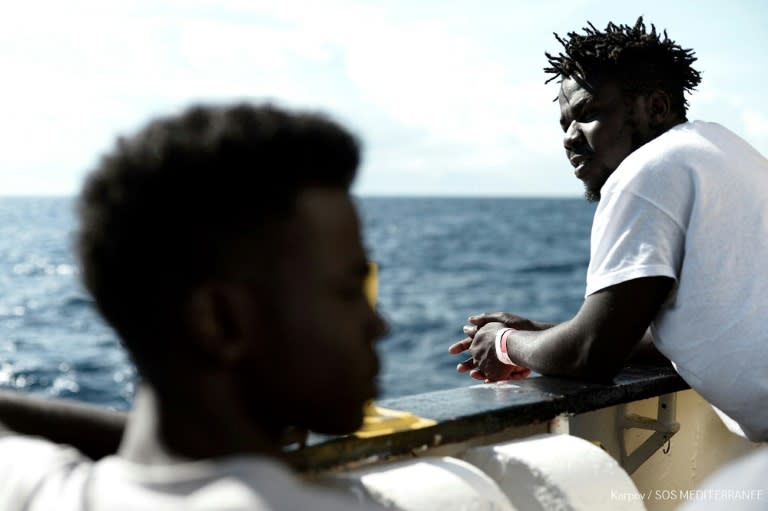 This handout picture obtained from French non-governmental organization Medecins Sans Frontieres -- Doctors Without Borders (MSF) -- shows migrants onboard the MV Aquarius at sea on June 14, 2018, after Italy refused to let it land
