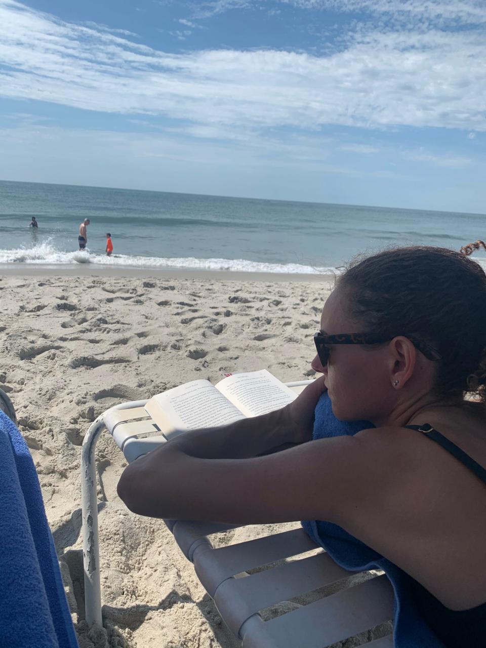 Phil Dengler's girlfriend, Robin England, lounges on the beach during their trip to Cape May, New Jersey, in June 2020.