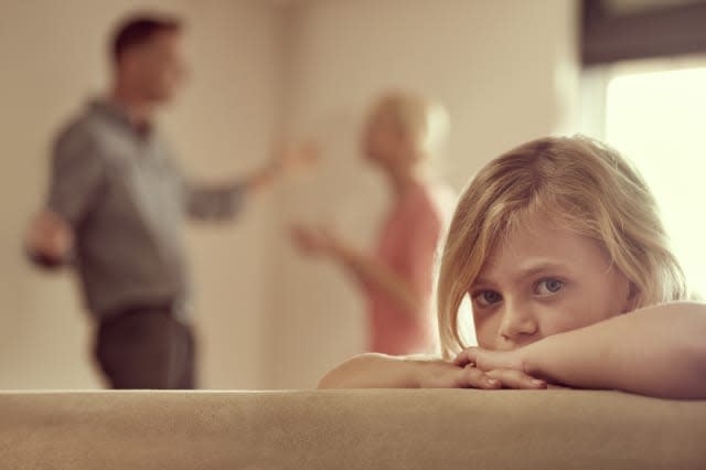 Shot of a little girl looking unhappy as her parents argue in the backgroundhttp://195.154.178.81/DATA/i_collage/pi/shoots/78329