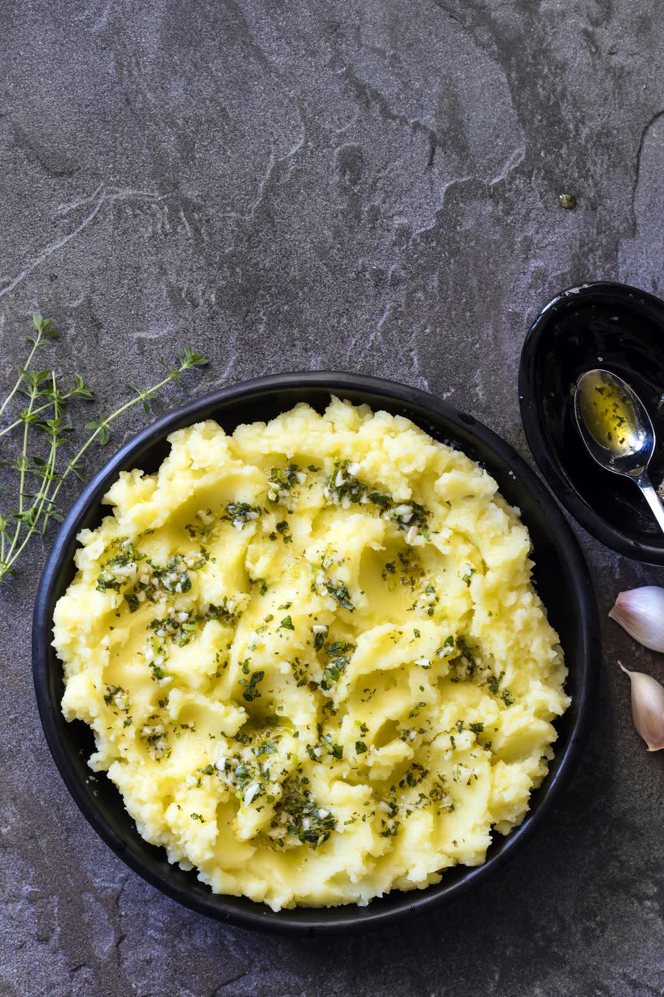 potato mash with olive oil garlic lemon and herbs top view