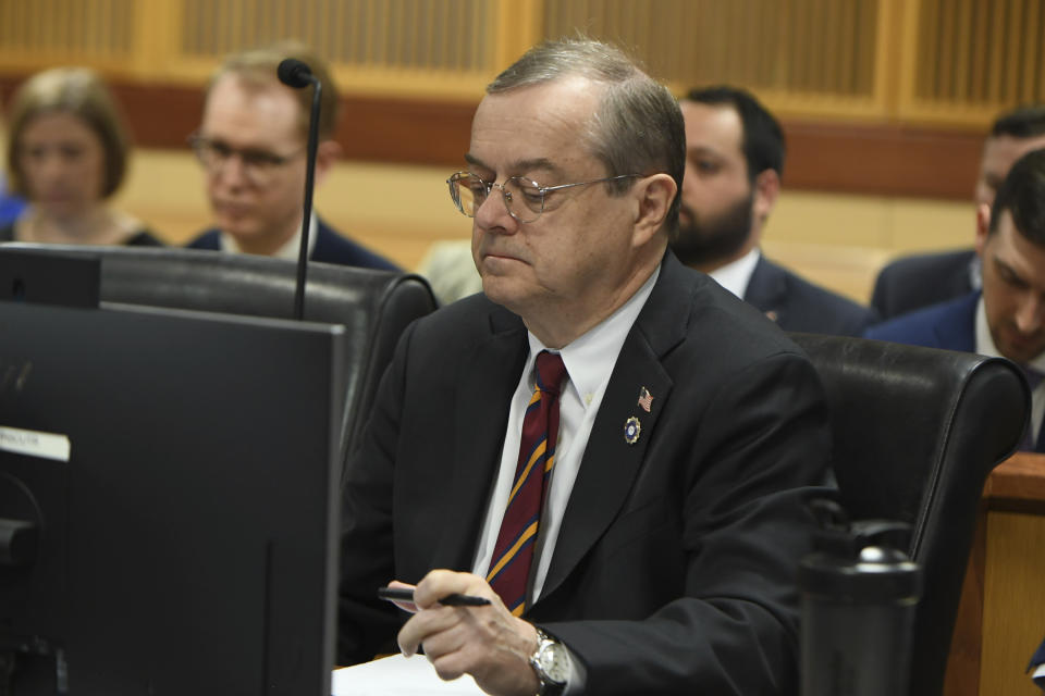 Deputy District Attorney John Floyd listen to the judge during a hearing on charges against former President Donald Trump in the Georgia election interference case on Thursday, March 28, 2024 in Atlanta. Lawyers for Trump argued in a court filing that the charges against him in the Georgia election interference case seek to criminalize political speech and advocacy conduct that is protected by the First Amendment. (Dennis Byron/Hip Hop Enquirer via AP)