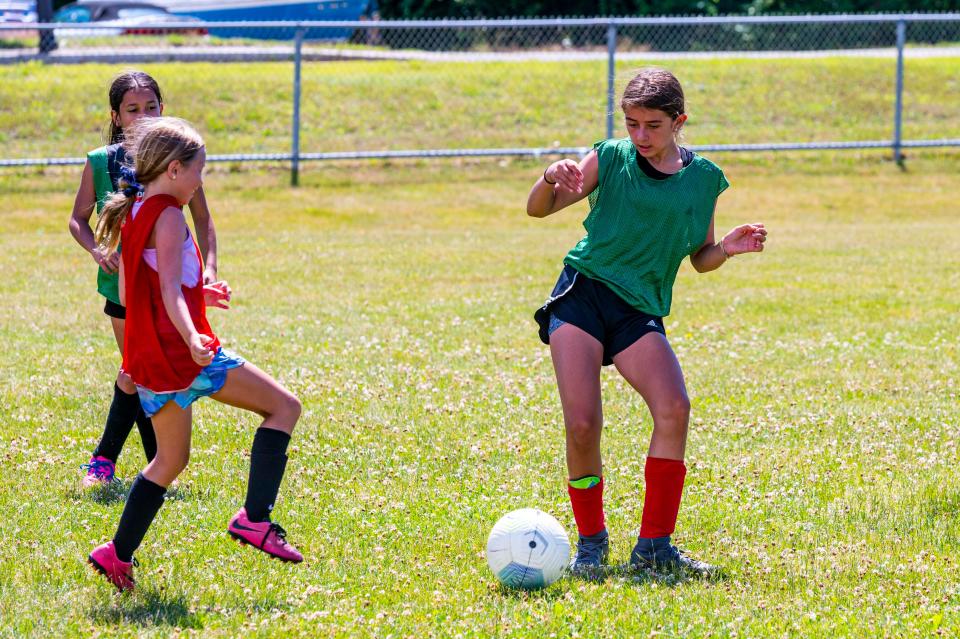 Zoe Papadakis makes the pass at the MATTREC Girls Soccer Clinic hosted by Meg Hughes at Old Rochester.