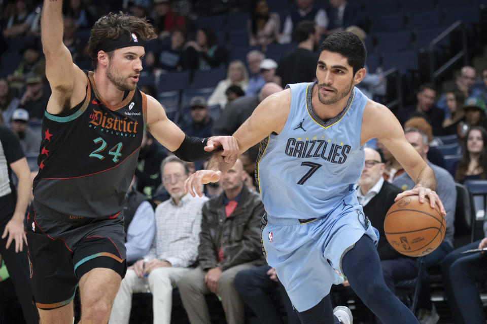 Washington Wizards forward Corey Kispert (24) defends against Memphis Grizzlies forward Santi Aldama (7) during the first half of an NBA basketball game Tuesday, March 12, 2024, in Memphis, Tenn. (AP Photo/Nikki Boertman)