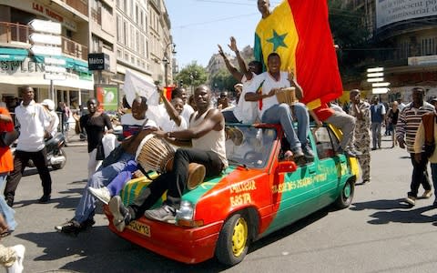 Senegal fans are a colourful bunch - Credit: ap