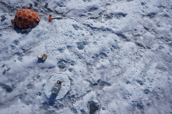 The researchers camped out in tents for most of the summer and used a spectrometer to measure how reflective the surrounding ice was.