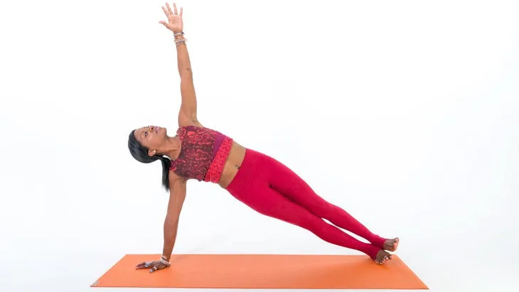 Woman demonstrates Side Plank Pose