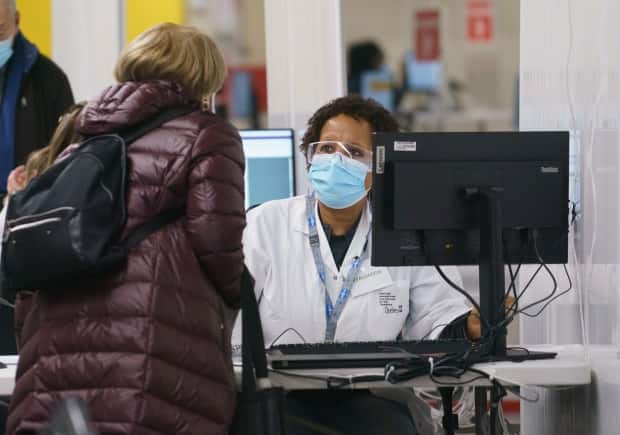 The province will begin vaccinating the general population next Monday, and one of the vaccination clinics will be inside Montreal's Olympic Stadium. (Paul Chiasson/The Canadian Press - image credit)