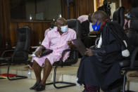 FILE - In this Friday, Feb. 26, 2021 file photo, Paul Rusesabagina, whose story inspired the film "Hotel Rwanda" for saving people from genocide, speaks to lawyers as he attends a court hearing in Kigali, Rwanda. A court in Rwanda said Monday, Sept. 20, 2021 that Rusesabagina, who boycotted the announcement after declaring he didn't expect justice in a trial he called a "sham", is guilty of terror-related offenses. (AP Photo/Muhizi Olivier, File)