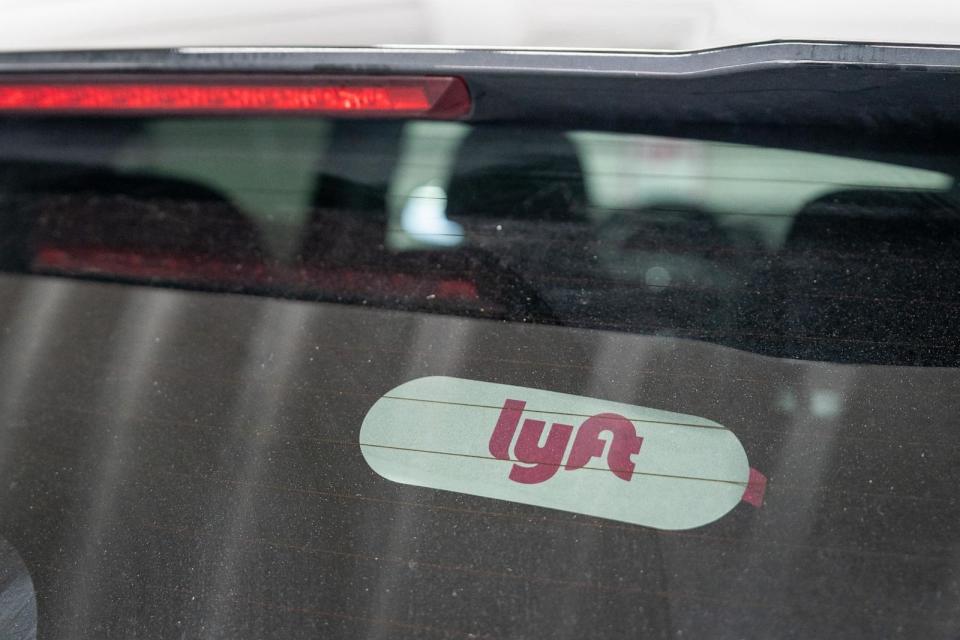 PHOTO: Lyft signage on a car in San Francisco, Feb. 8, 2024. (Loren Elliott/Bloomberg via Getty Images)