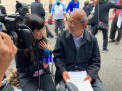 Shoei Su, a retired appraiser, is interviewed by the media nearly a week after a deadly shooting at a Taiwanese American church congregation in Laguna Woods, Calif., Saturday, May 21, 2022. He said the shooter said nothing before firing on churchgoers who were snapping photos after finishing lunch following last Sunday morning's prayer service. (AP Photo/Amy Taxin)