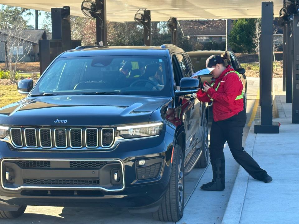 Chick-fil-A in Petal, Miss., employee Ella Brooke Seymour checks an order as the restaurant welcomed customers on opening day, Thursday, Jan. 5, 2023.