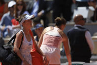 Ukraine's Elina Svitolina, left, walks past Aryna Sabalenka of Belarus after losing against her during their quarter final match of the French Open tennis tournament at the Roland Garros stadium in Paris, Tuesday, June 6, 2023. (AP Photo/Aurelien Morissard)