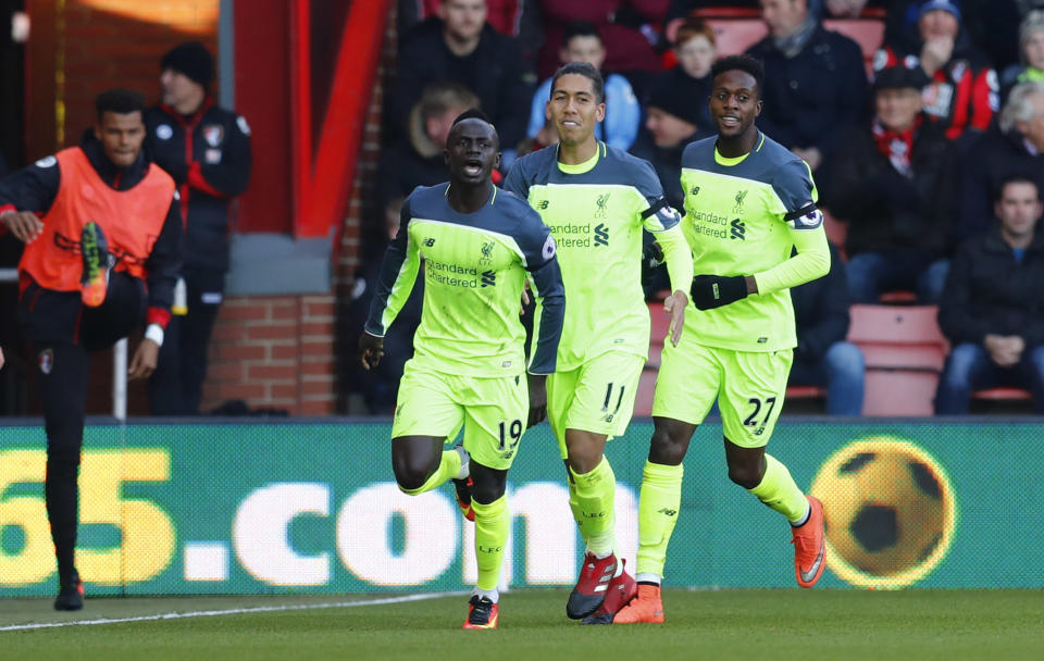 Football Soccer Britain - AFC Bournemouth v Liverpool - Premier League - Vitality Stadium - 4/12/16 Liverpool's Sadio Mane celebrates scoring their first goal with Divock Origi and Roberto Firmino Reuters / Eddie Keogh Livepic EDITORIAL USE ONLY. No use with unauthorized audio, video, data, fixture lists, club/league logos or "live" services. Online in-match use limited to 45 images, no video emulation. No use in betting, games or single club/league/player publications. Please contact your account representative for further details.