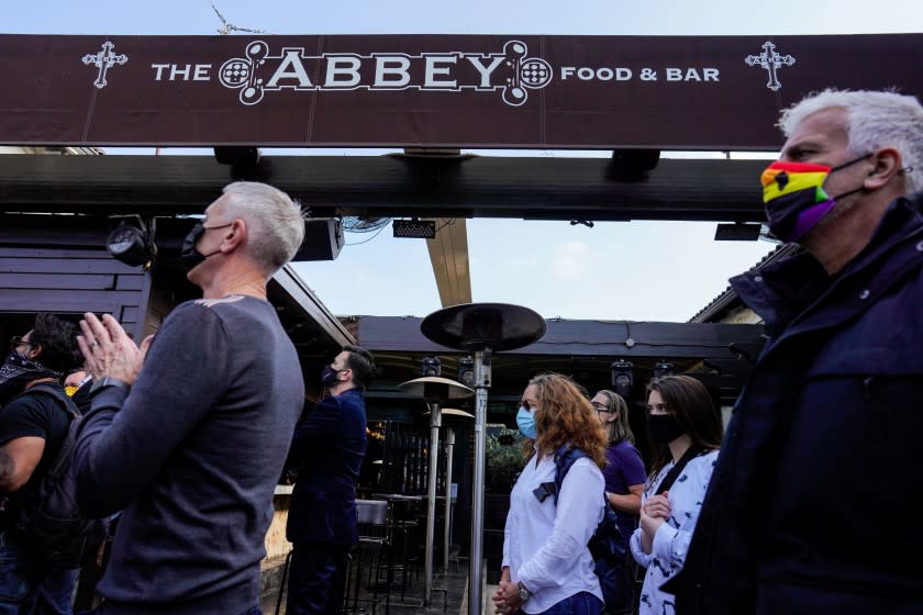 WEST HOLLYWOOD, CA - NOVEMBER 25: Supporters and business owners of area restaurants and businesses listen to a press conference held by the California Coalition for Safe Reopening at The Abbey on Wednesday, Nov. 25, 2020 in West Hollywood, CA. L.A. County restaurant owners fear they won't survive another COVID-19 shutdown. (Kent Nishimura / Los Angeles Times)