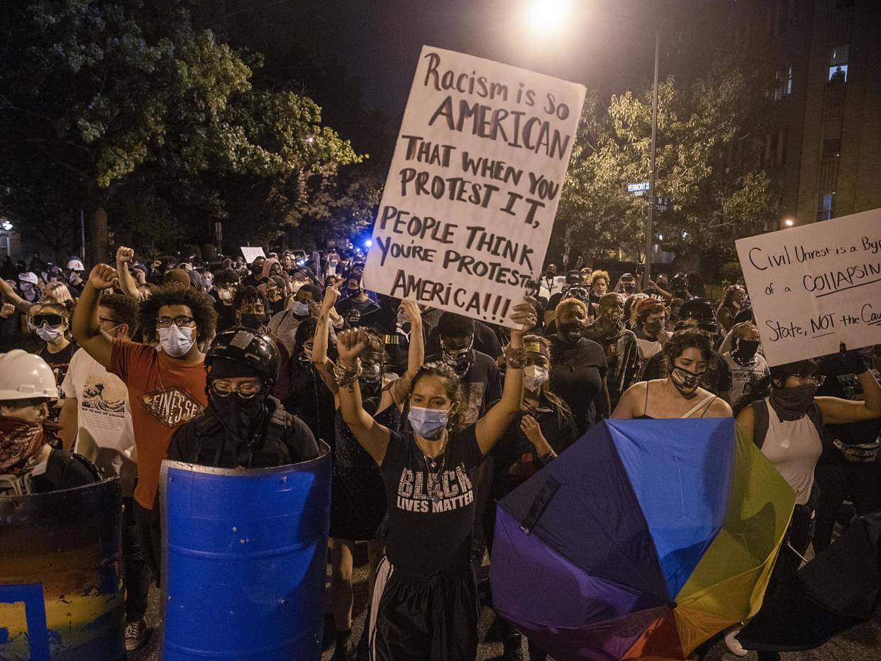 Anti-Trump protesters march around downtown on 30 August 2020 in Washington, DC: (2020 Getty Images)