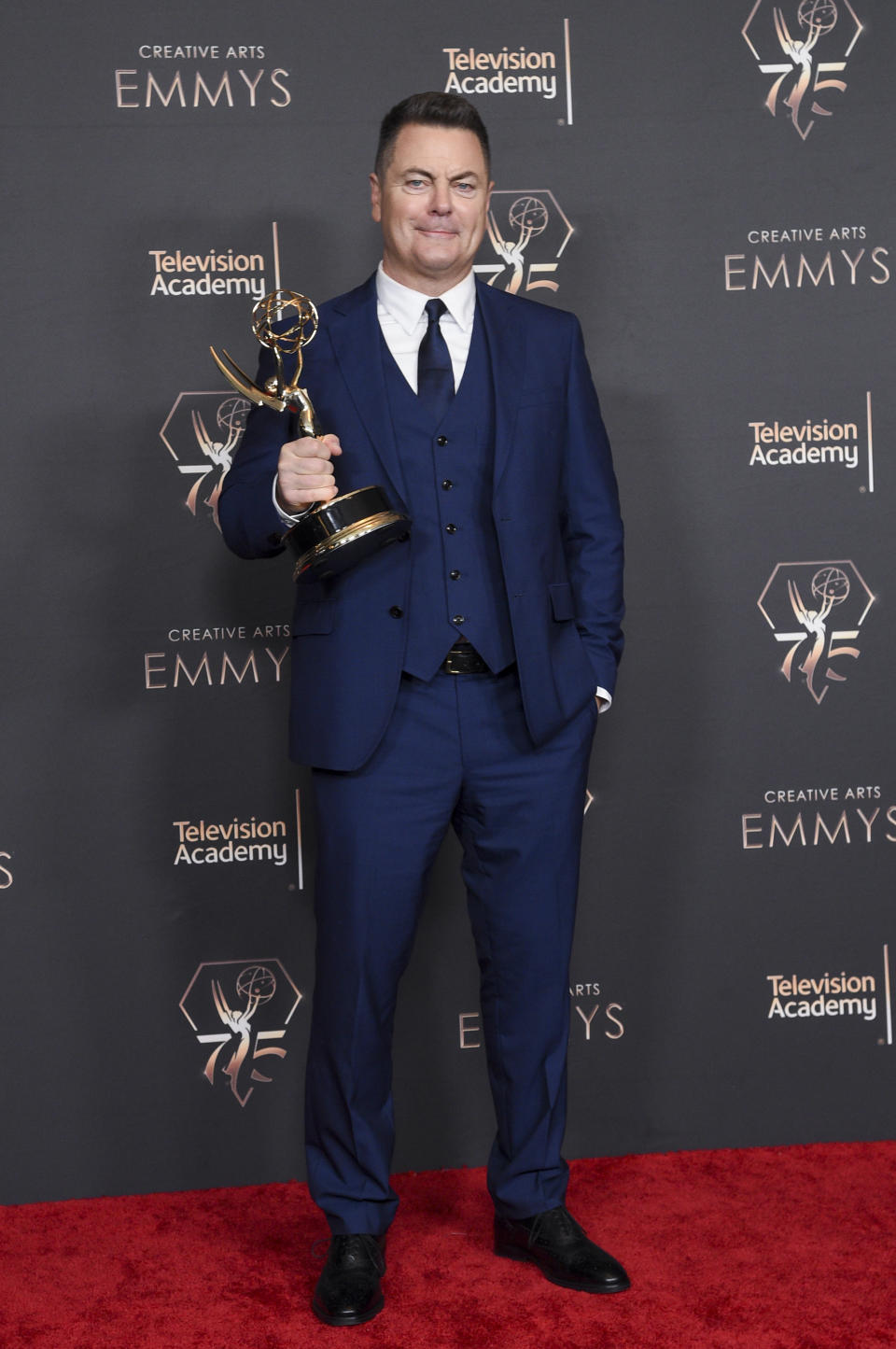 Nick Offerman poses in the press room with the award for outstanding guest actor in a drama series for "The Last Of Us - Long, Long Time" during night one of the Creative Arts Emmy Awards on Saturday, Jan. 6, 2024, at the Peacock Theater in Los Angeles. (Photo by Richard Shotwell/Invision/AP)