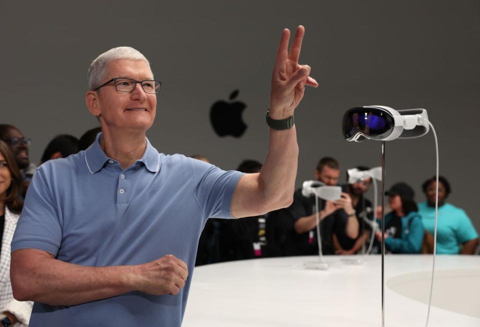 Tim Cook with the Apple Vision Pro at an unveiling event