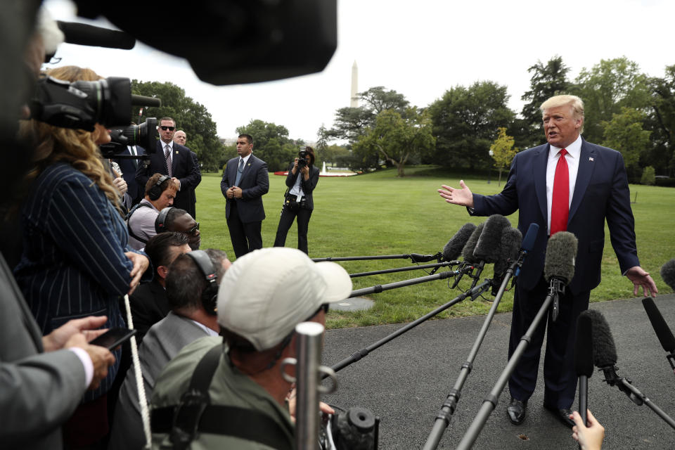 President Donald Trump speaks to members of the media on the South Lawn of the White House in Washington, Monday, Sept. 9, 2019, before boarding Marine One for a short trip to Andrews Air Force Base, Md., and then on to North Carolina. (AP Photo/Andrew Harnik)