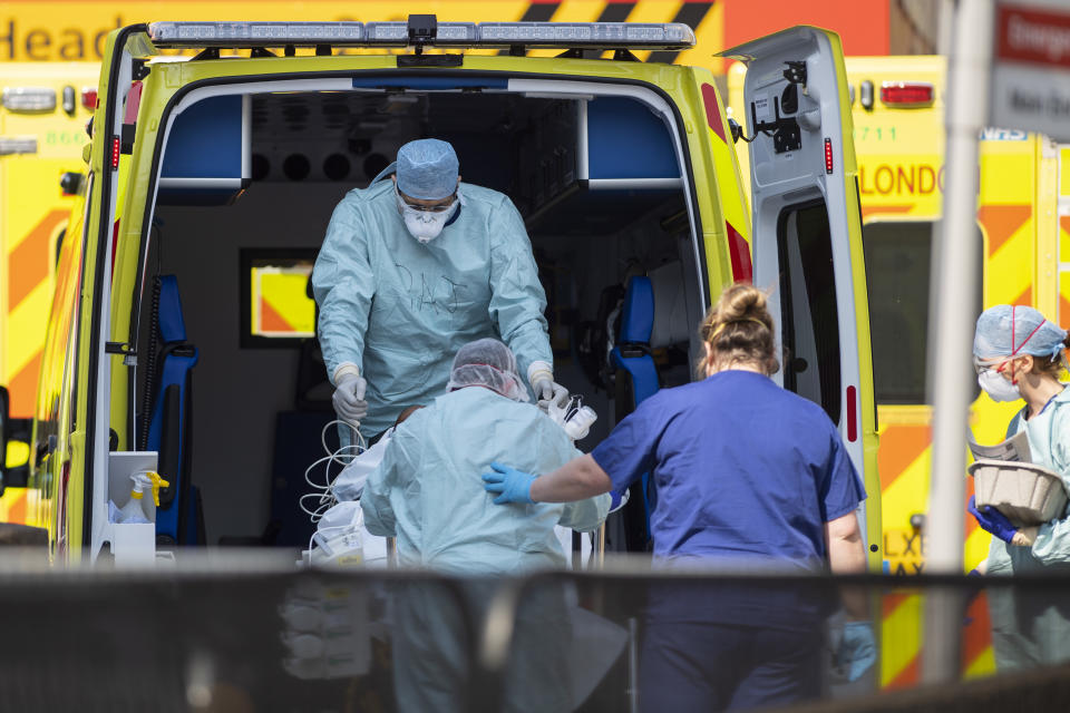 LONDON, UNITED KINGDOM - APRIL 10: NHS workers in PPE take a patient with an unknown condition from an ambulance at St Thomas' Hospital on April 10, 2020 in London, England. Public Easter events have been cancelled across the country, with the government urging the public to respect lockdown measures by celebrating the holiday in their homes. Over 1.5 million people across the world have been infected with the COVID-19 coronavirus, with over 7,000 fatalities recorded in the United Kingdom.   (Photo by Justin Setterfield/Getty Images)