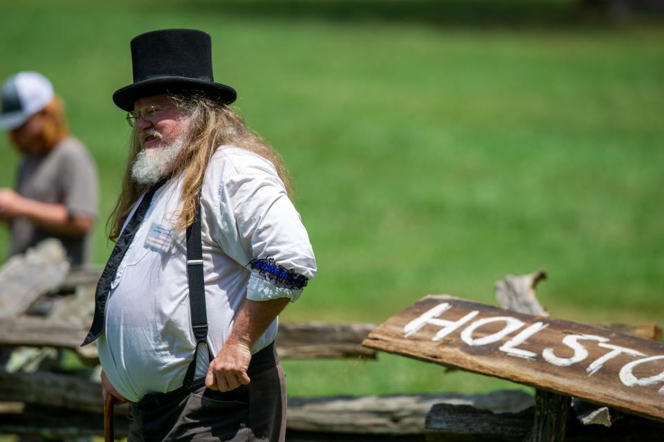 A dead-ball era referee watches during an old-time baseball exhibition at the 2022 Museum of Appalachia Anvil Shoot in Clinton, Tenn. on Monday, July 4, 2022.