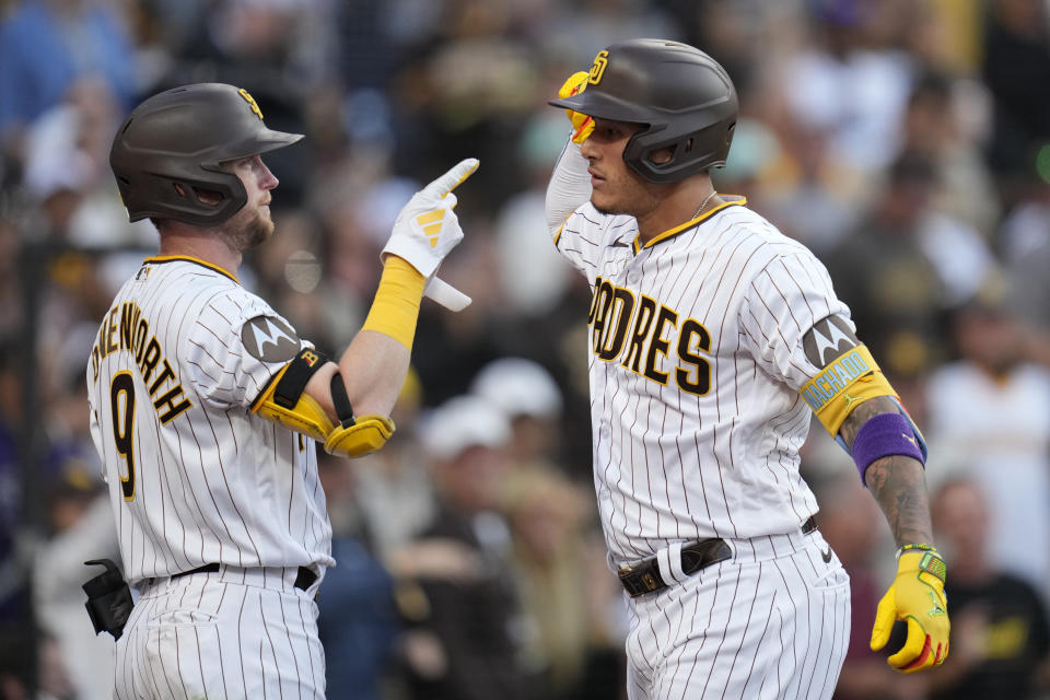 San Diego Padres' Manny Machado, right, celebrates with teammate Jake Cronenworth after hitting a home run during the sixth inning of a baseball game against the Los Angeles Angels, Wednesday, July 5, 2023, in San Diego. (AP Photo/Gregory Bull)